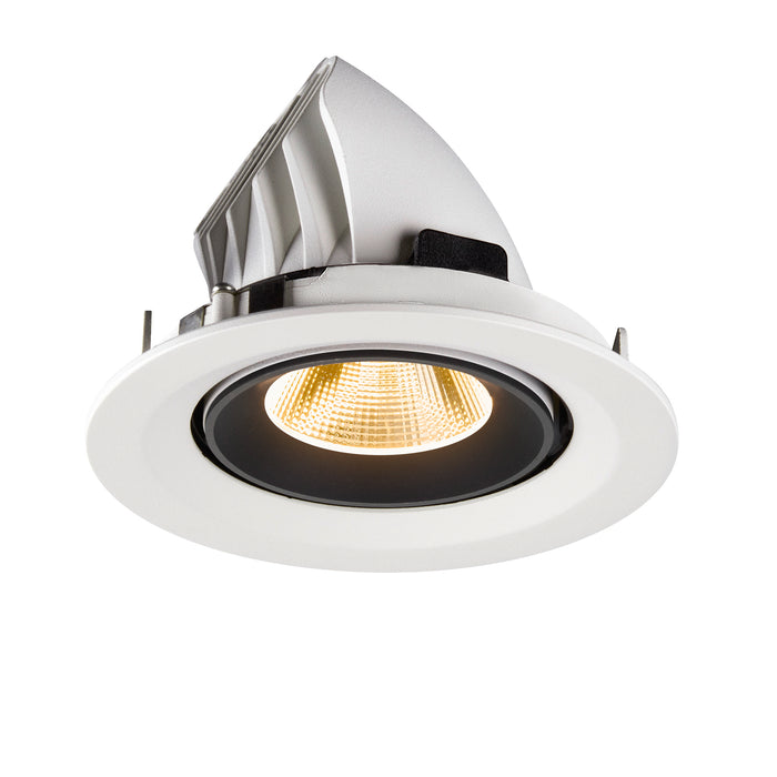 Recessed ceiling light fixture made of aluminum with a matte white finish and black accents, featuring a warm LED bulb and adjustable mounting.