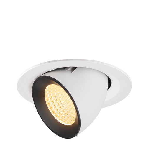Recessed spotlight in white metal with a black trim, featuring a warm LED bulb and designed for ceiling mounting.