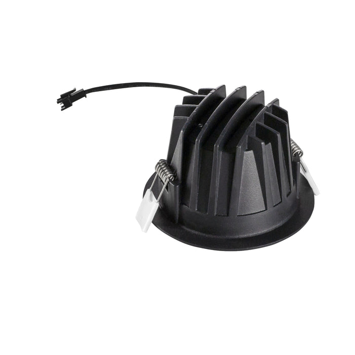 Black plastic LED downlight housing with a ribbed design, featuring metal mounting clips and a connected wire for easy installation.