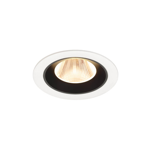 Recessed ceiling light fixture with a white metal finish, black interior, and a warm LED bulb for modern lighting solutions.