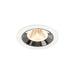 Recessed ceiling light fixture made of metal with a chrome finish and white trim, featuring a warm LED bulb for modern illumination.