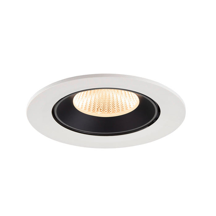 Recessed ceiling light fixture made of metal with a matte white finish and black interior, featuring a warm LED bulb for efficient illumination.