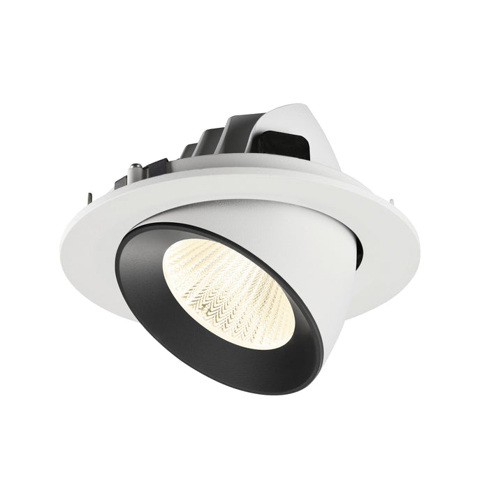 Recessed ceiling light fixture with a white and black finish, made of metal, featuring a textured lens for focused illumination.