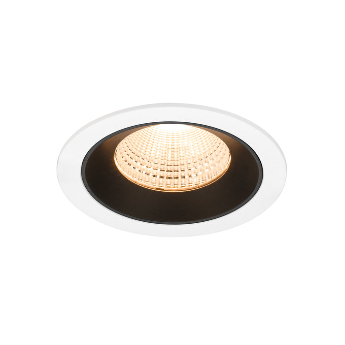 Recessed ceiling light fixture with a white and black finish, featuring a glass lens and warm white LED light source.