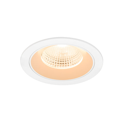 Recessed LED downlight with white trim and warm light.