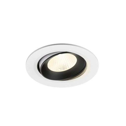 Recessed ceiling light fixture with a black and white finish, made of metal, featuring a textured glass lens for soft illumination.