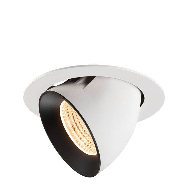 Recessed ceiling light fixture made of metal with a matte white finish and black interior, featuring a warm LED bulb.