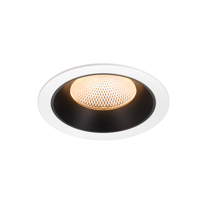 Recessed ceiling light fixture with a black and white finish, featuring a honeycomb pattern and warm LED light source.