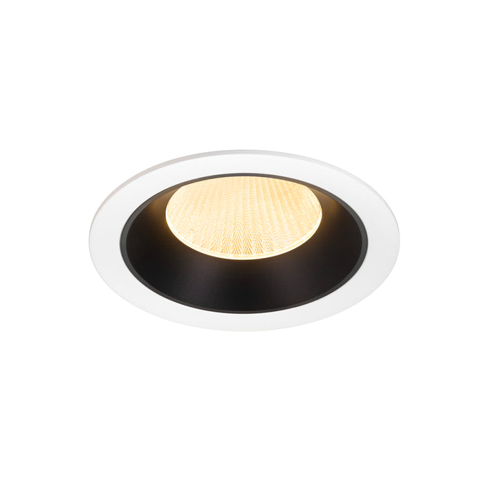 Recessed ceiling light fixture with a white and black finish, featuring a textured glass lens and warm LED illumination.