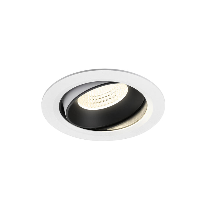 Recessed ceiling light fixture with a black and white finish, made of metal, featuring a round design and adjustable spotlight.