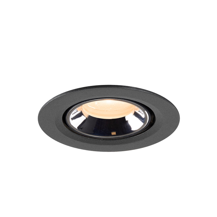 Recessed ceiling light fixture in black metal with a polished chrome interior, designed for flush mounting and providing warm illumination.