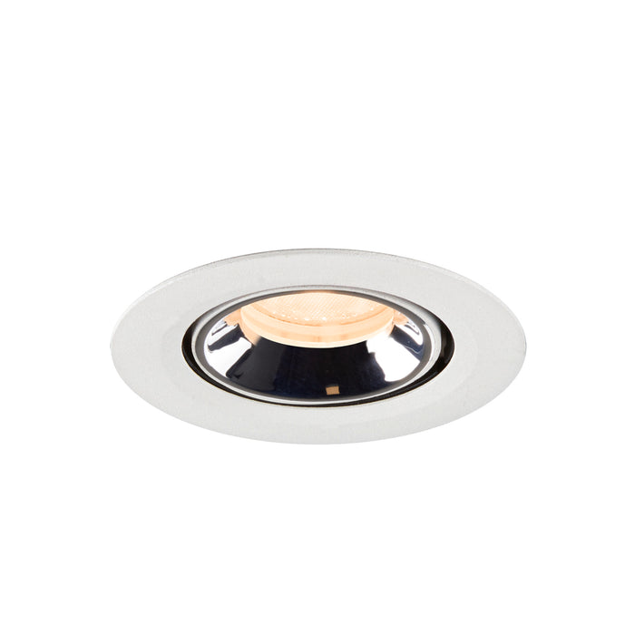 Recessed ceiling light fixture in polished chrome finish with a white trim, featuring a warm LED bulb for ambient lighting.