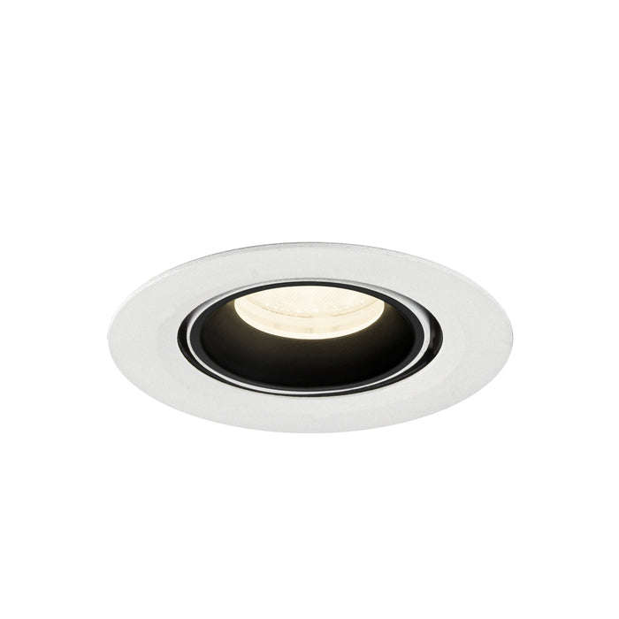 Recessed ceiling light fixture in white metal finish with a black interior, featuring a round design and warm white LED bulb.