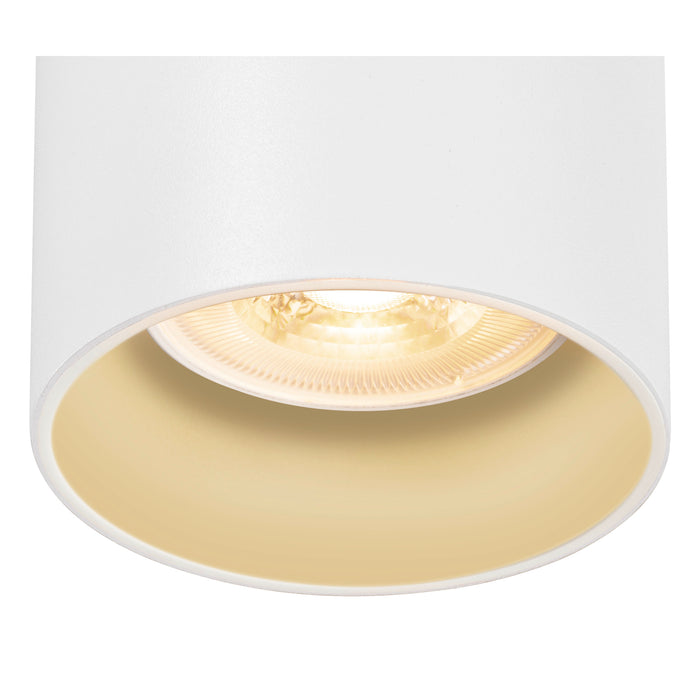 White metal recessed ceiling light fixture with gold interior.