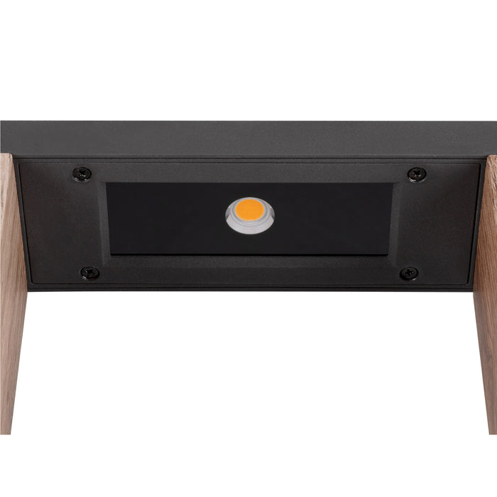 Undercabinet light fixture, black finish, wood trim, recessed mounting.