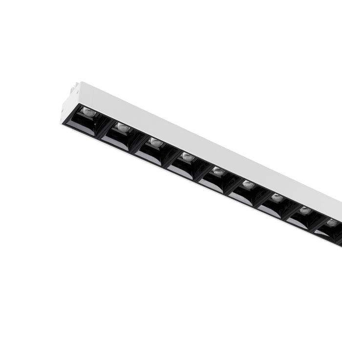 White recessed linear LED light fixture with black baffle.