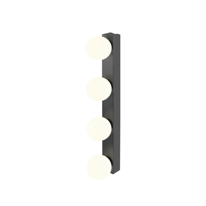 Black metal wall sconce with four round white glass shades.