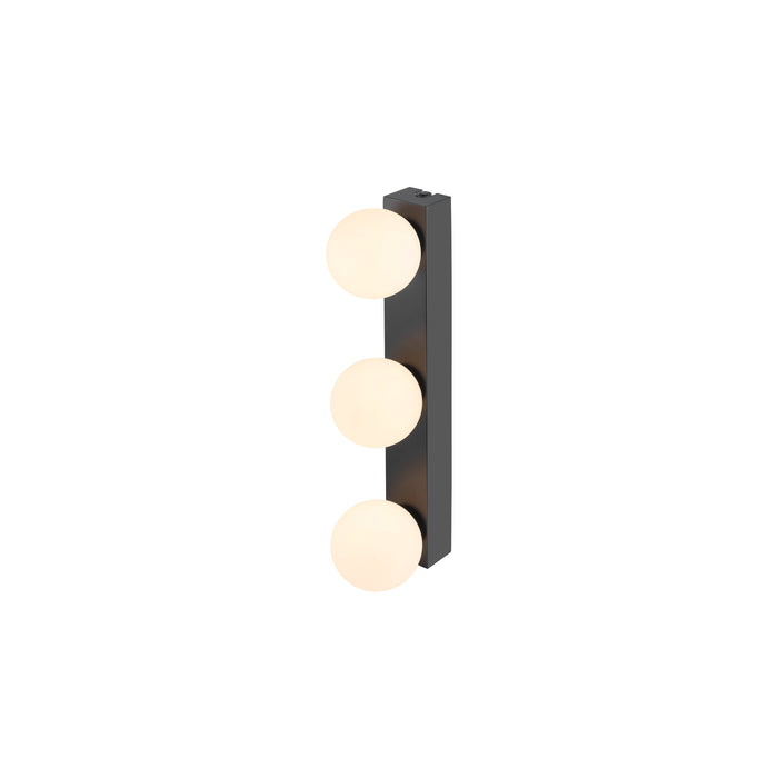 Black metal wall sconce with three round opal glass shades.