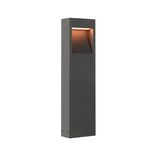 Gray metal bollard light fixture with textured finish, ground mounted.