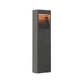 Gray metal bollard light fixture with textured finish, ground mounted.