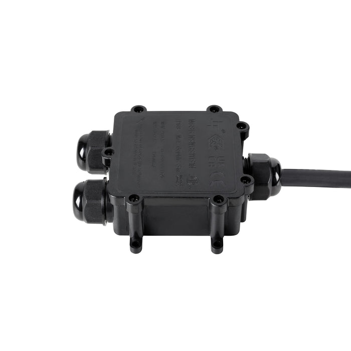 Black plastic junction box with cable glands, surface mounted.