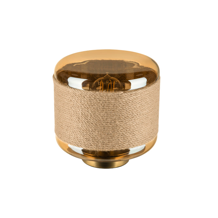 Table lamp with amber glass top, rope-wrapped body, and gold base.