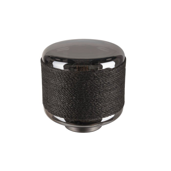 Black glass and woven fabric light fixture with a polished finish.