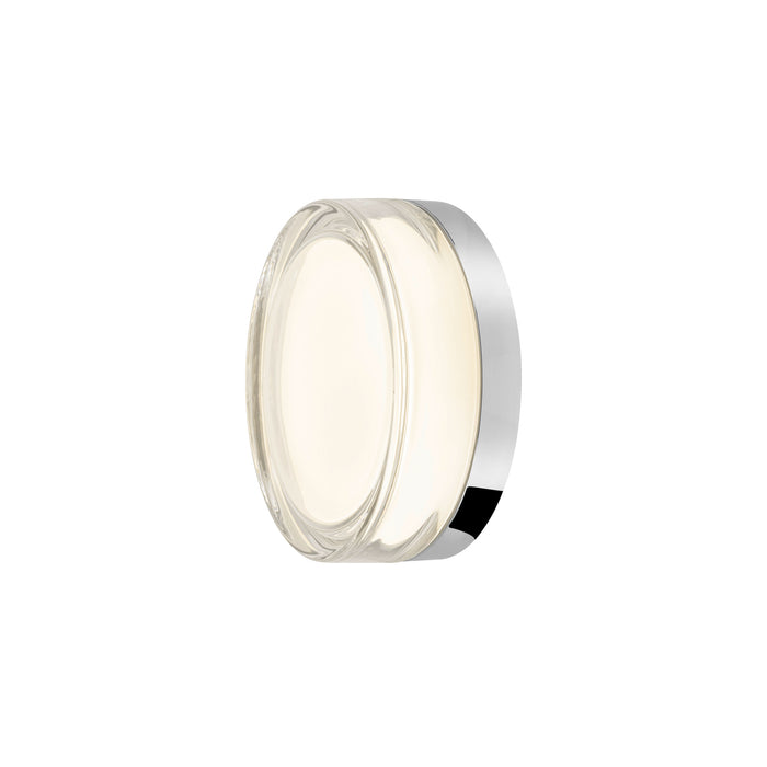 Clear glass wall sconce with polished chrome finish.