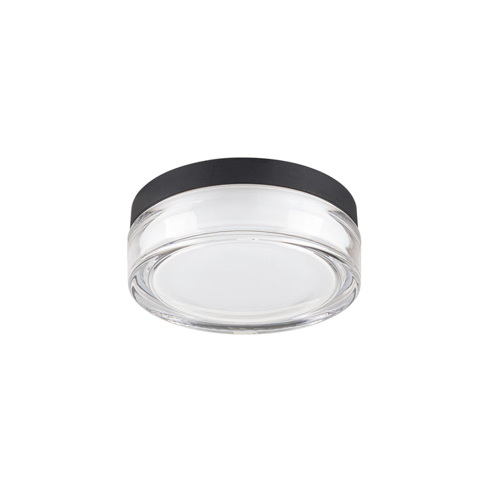 Clear glass surface-mounted light fixture with black trim.