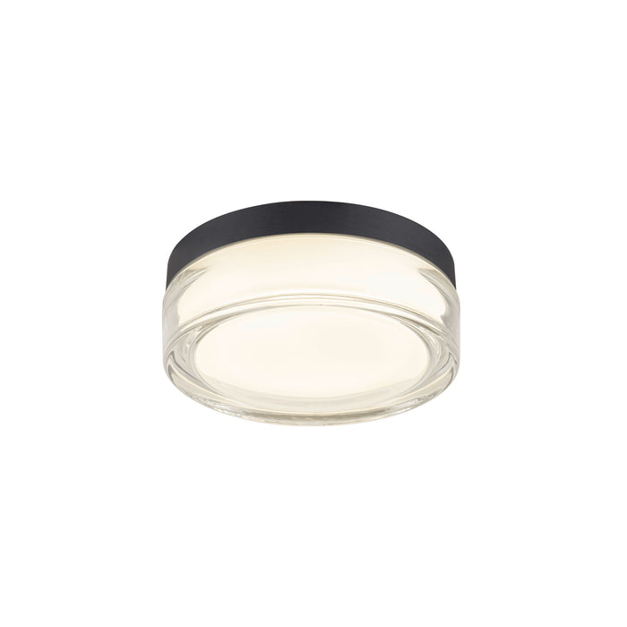 Flush mount ceiling light with clear glass shade and black trim.