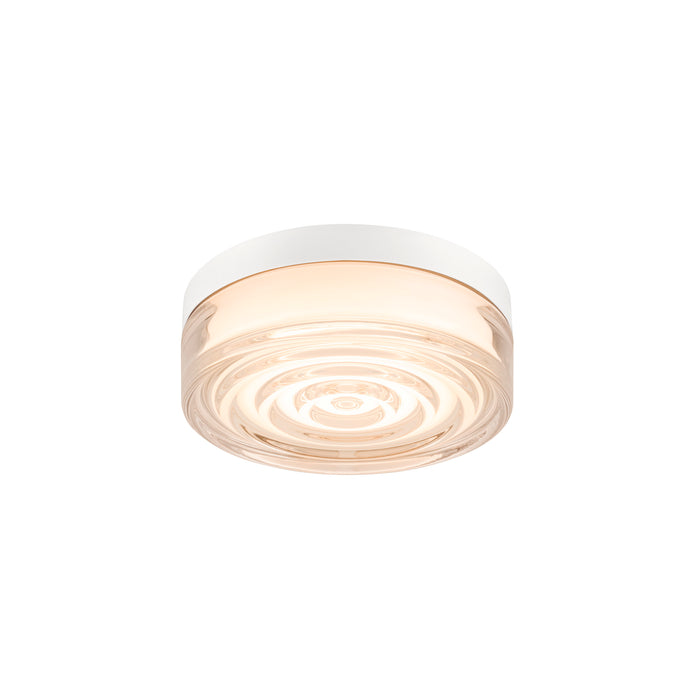 Glass flush mount ceiling light fixture with white trim.