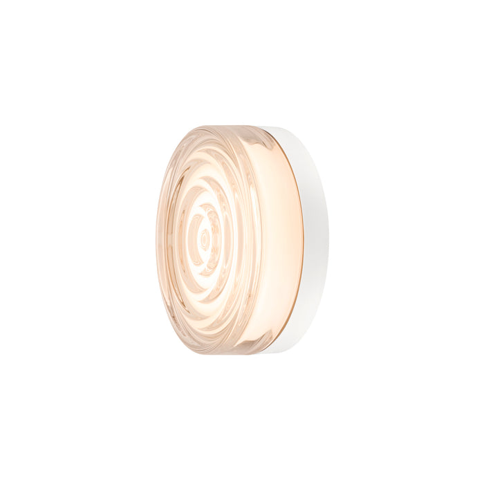 Round glass wall sconce with a white base and a swirling pattern.