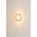 Clear glass wall sconce with white mounting.