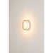 Clear glass wall sconce with a white base, mounted on a white wall.