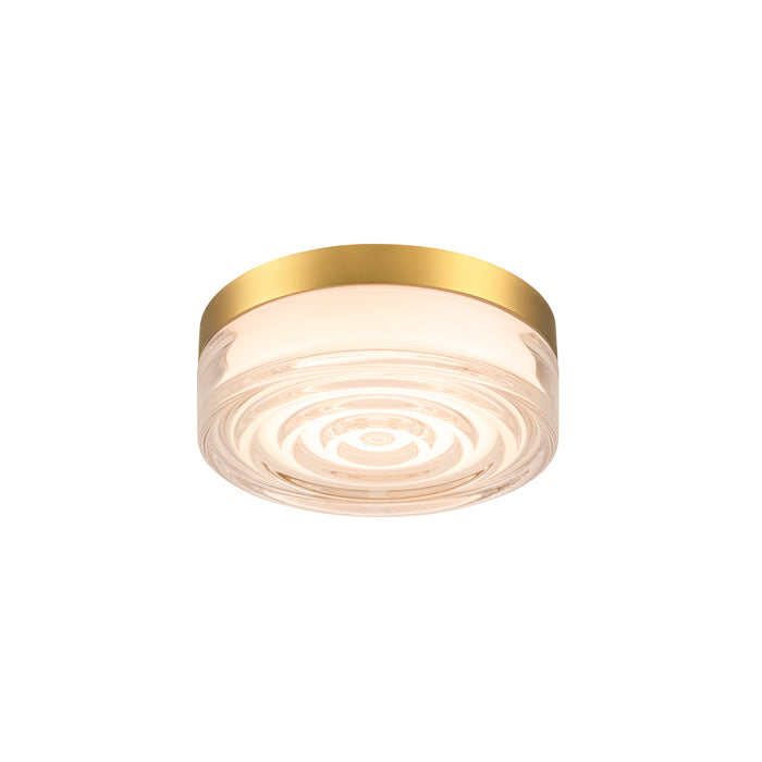 Glass flush mount ceiling light fixture with a gold finish.