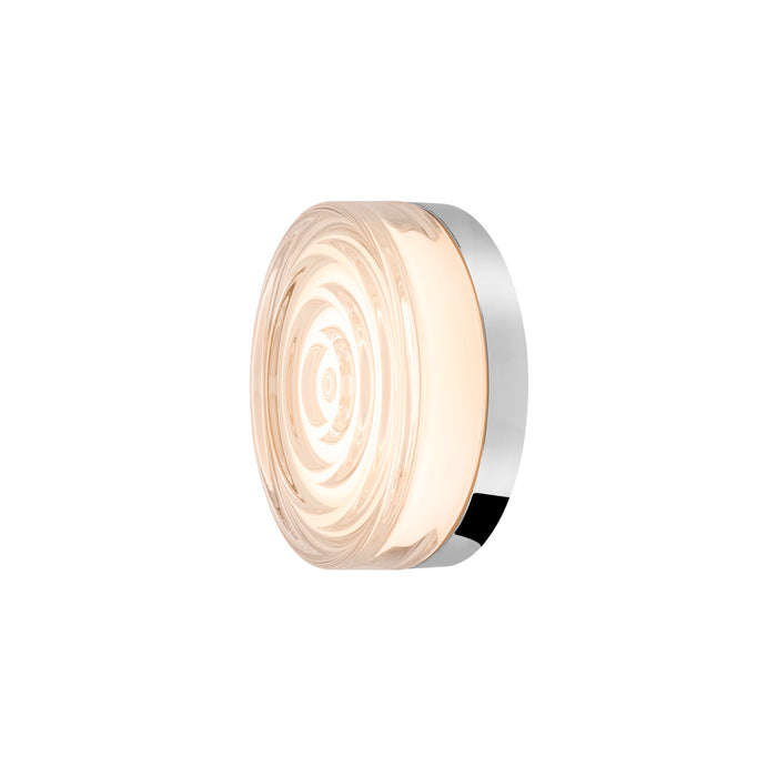 Round glass wall sconce with swirl pattern and polished chrome mounting.