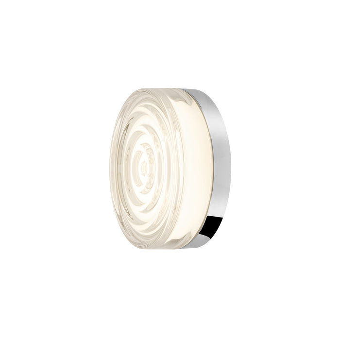 Round glass wall sconce with a polished chrome finish.