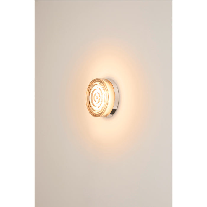 Glass wall sconce with chrome finish.