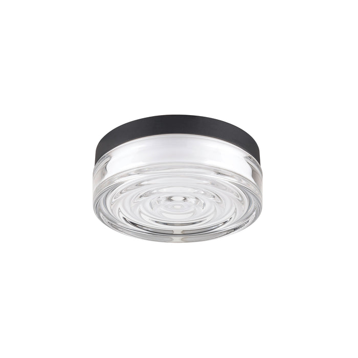 Clear glass flush mount ceiling light fixture with black trim.