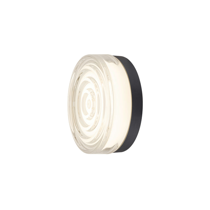 Round glass wall sconce with black metal mount.