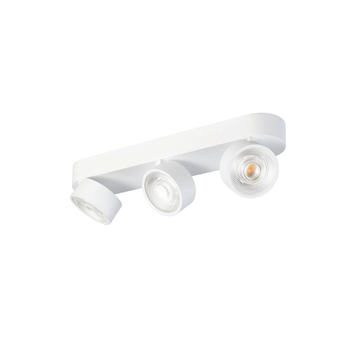 White metal track lighting fixture with three adjustable spotlights, surface mounted.