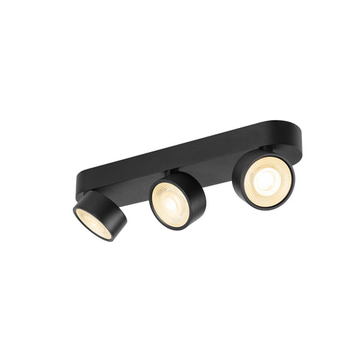 Black metal track lighting fixture with three adjustable spotlights, surface mounted.