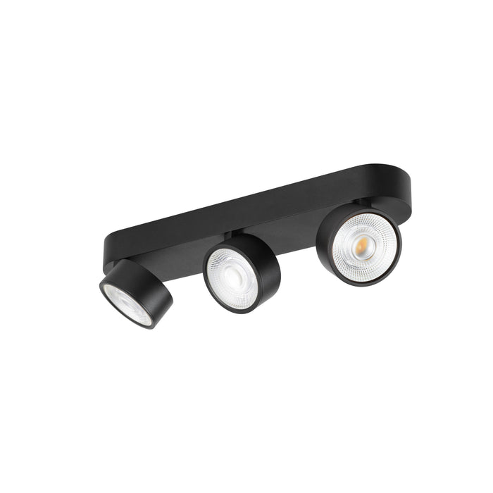 Black metal track lighting fixture with three adjustable spotlights, surface mounted.