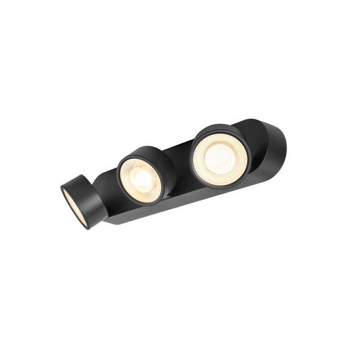 Black metal ceiling-mounted spotlight fixture with three adjustable heads.