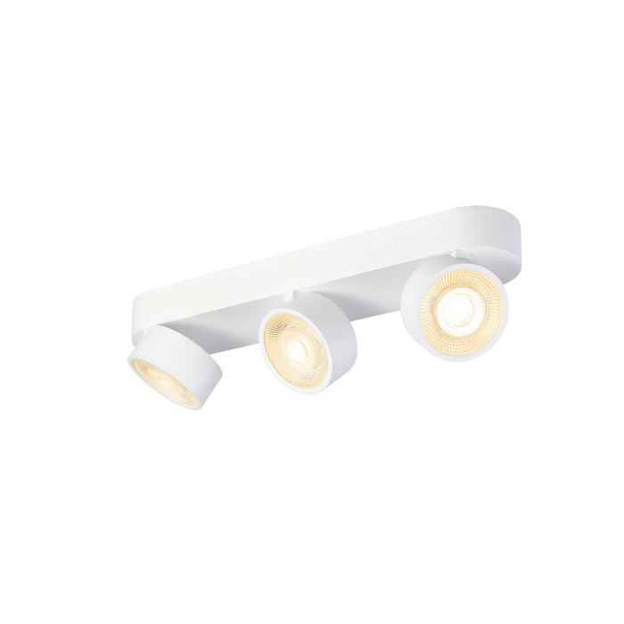 White metal track lighting fixture with three adjustable spotlights, surface mounted.