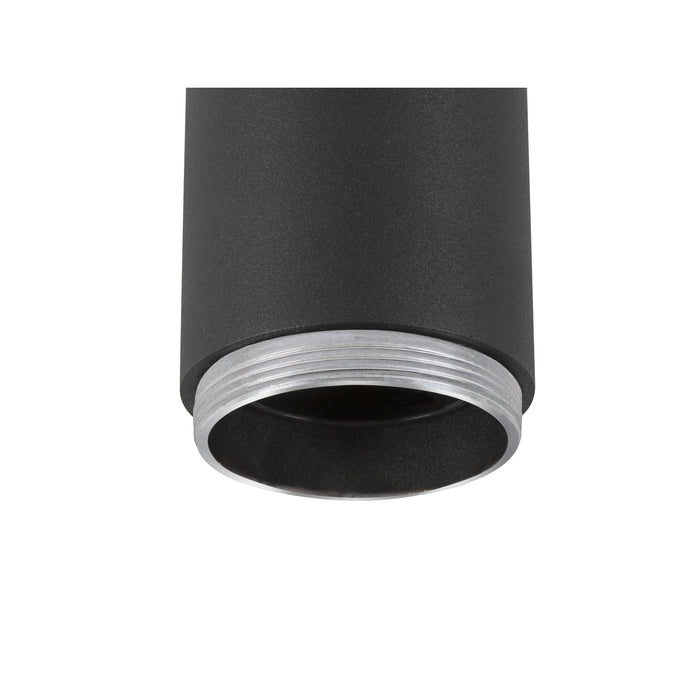 Close-up of a black, textured metal cylinder with a silver, threaded ring, likely a surface-mounted light fixture.