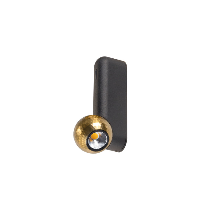 Wall-mounted spotlight with a geometric gold shade and a dark gray finish.