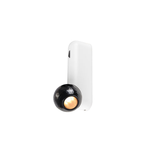 White wall-mounted spotlight with black faceted shade.