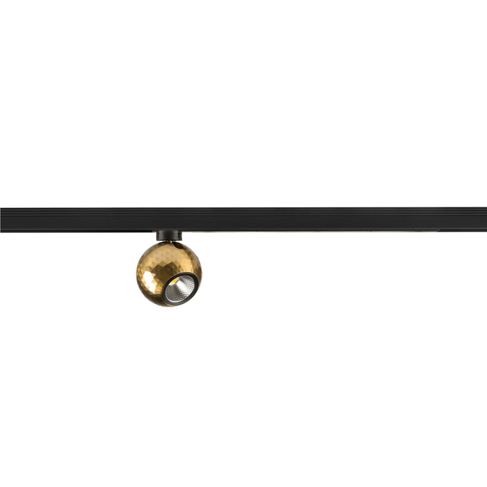 Gold textured sphere track light fixture on black track.