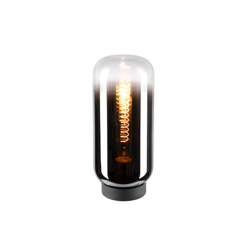 Glass table lamp with black base and exposed filament bulb.